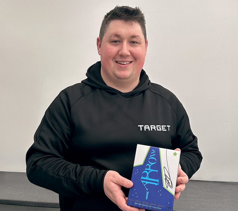Shane Mc Guirk Standing with Signed box of Special Edition Darts