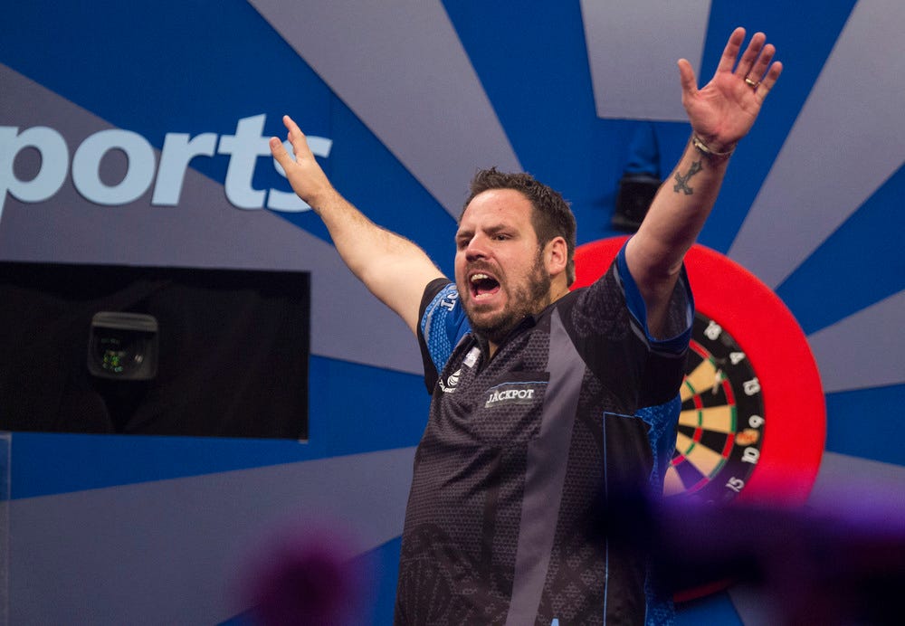 Adrian Lewis celebrating winning a match
