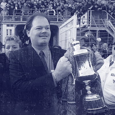 Raymond van Barneveld holding his World Championship trophy infront of a crowd as the Dutch darts madness began.
