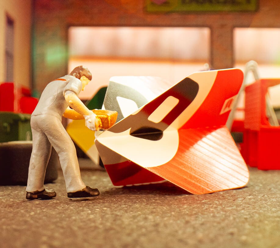 Miniature model fuelling the red Chicane dart flight