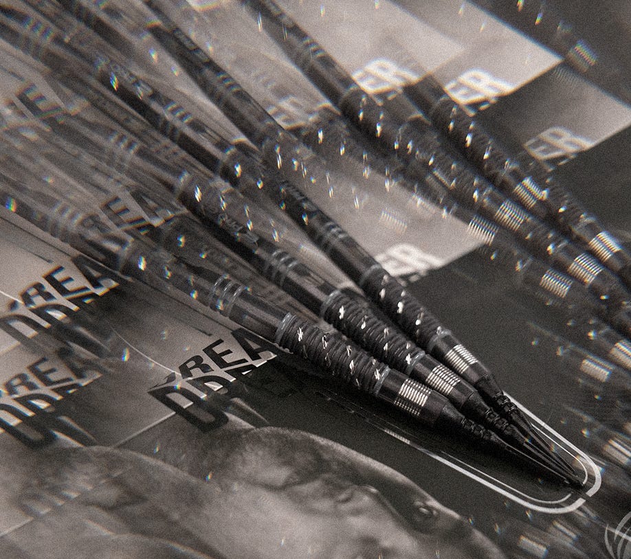 Close-up view of a set of Dimitri Van den Bergh x Echo soft tip darts.