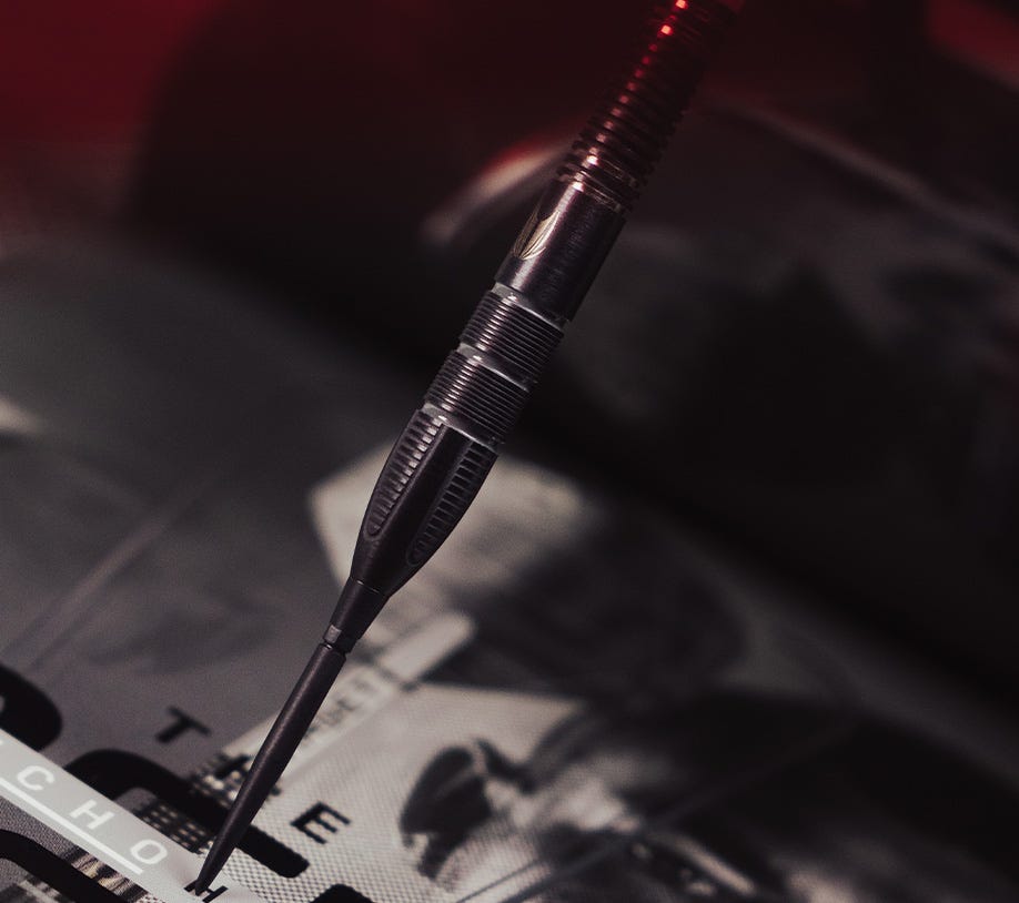 Angled view of the Nathan Aspinall x Echo steel tip dart.