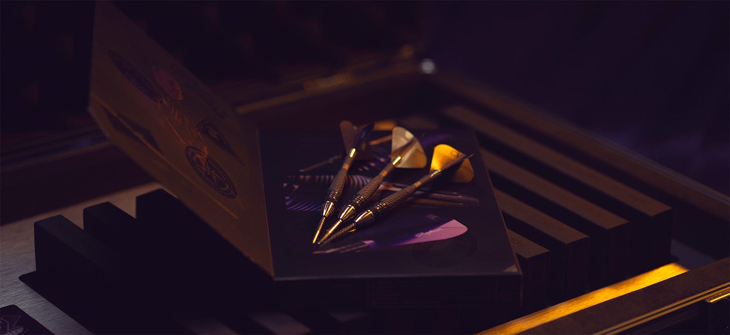 The Power Collection with ten generations of Power 9Five steel tip darts.