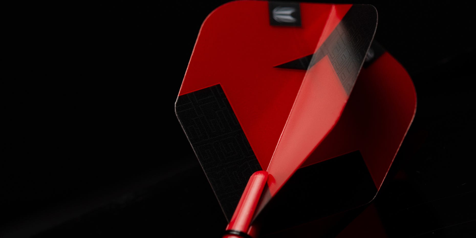 A close-up of the TAG dart flights in red.