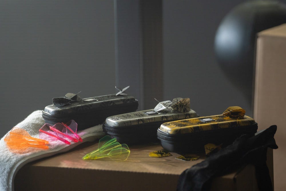 Darts cases and flights in lifestyle shot