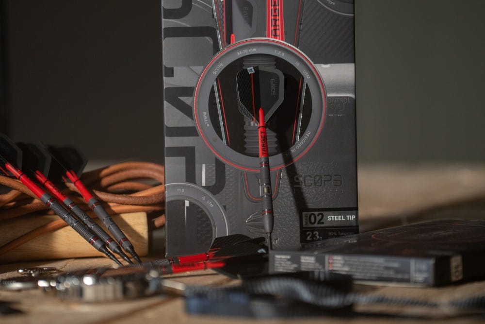 Scope darts set in formation next to their box on a table