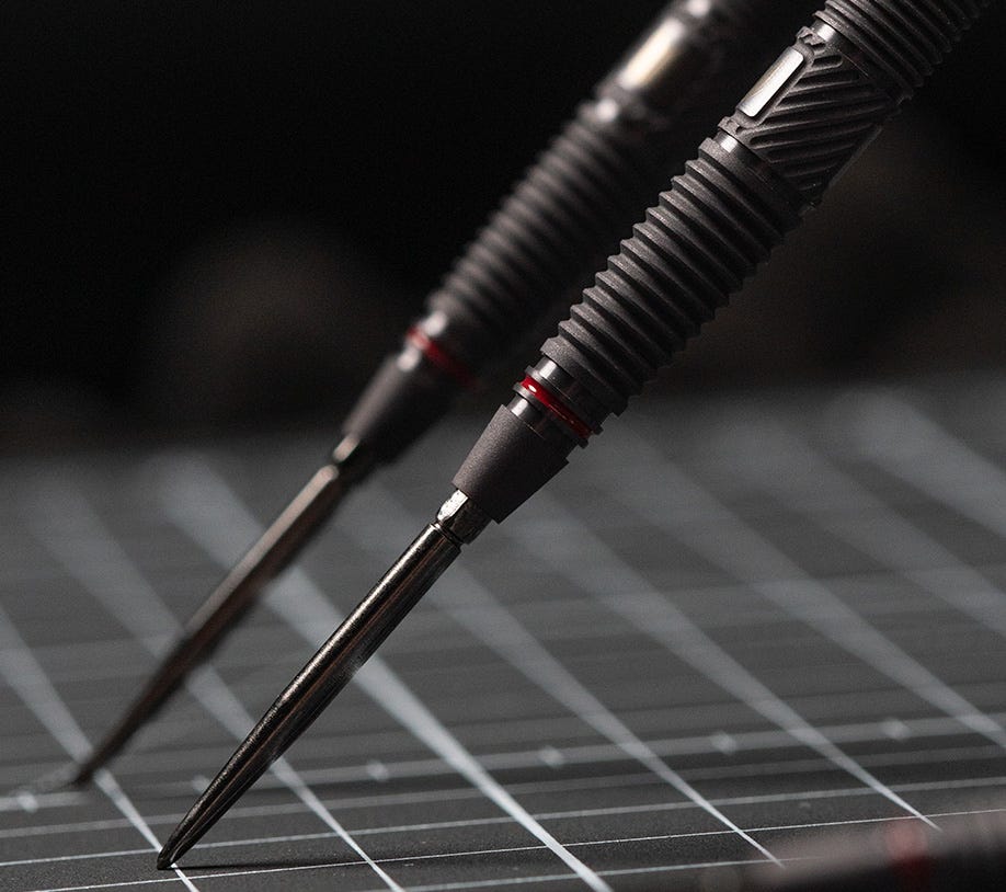 Scope steel tip darts standing on their ends