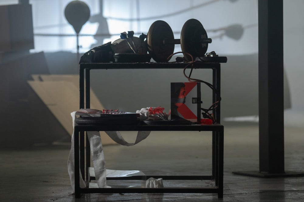 Target Darts player darts layed out on weights racking